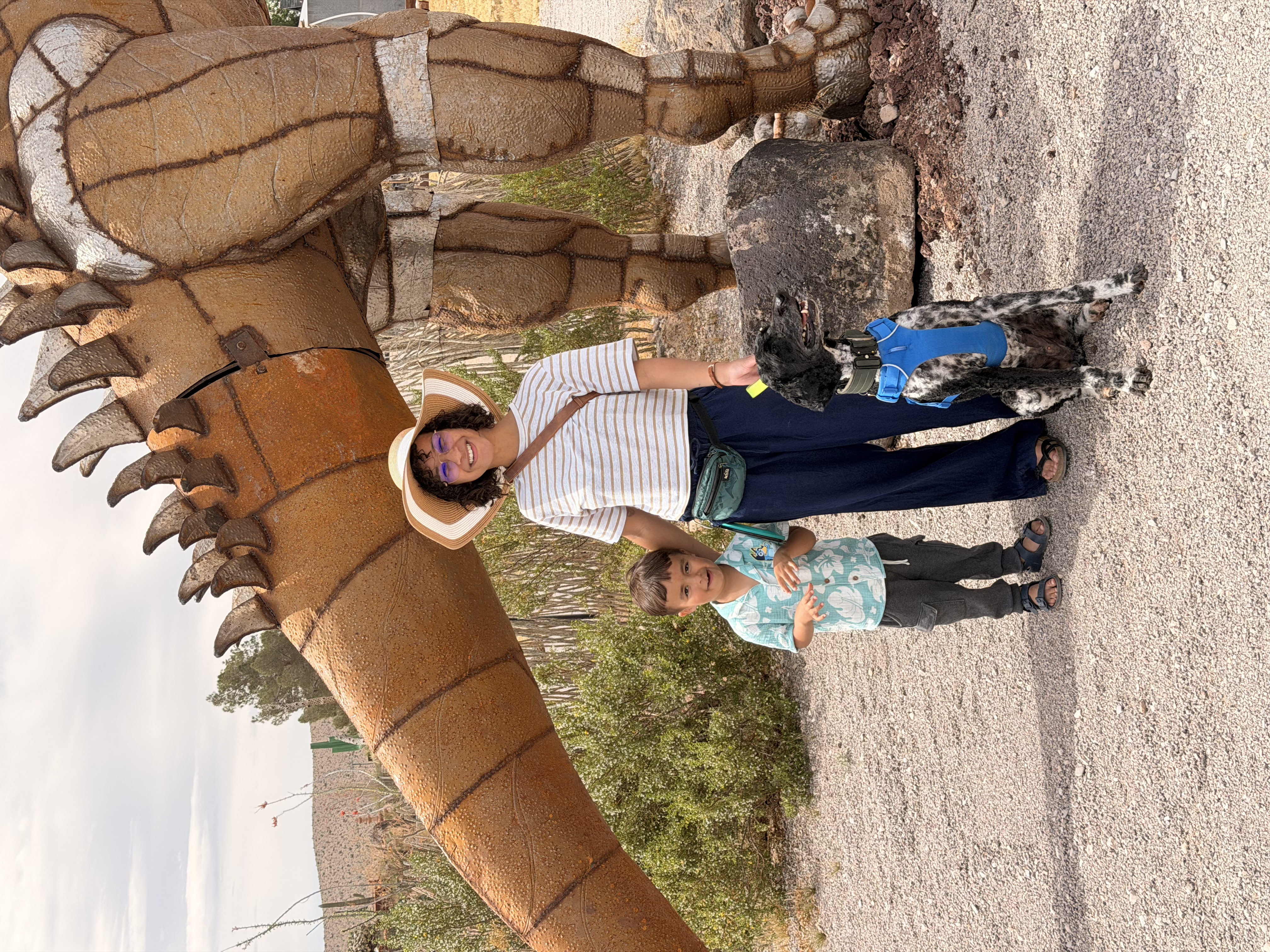 Steph with her family at a dinosaur park